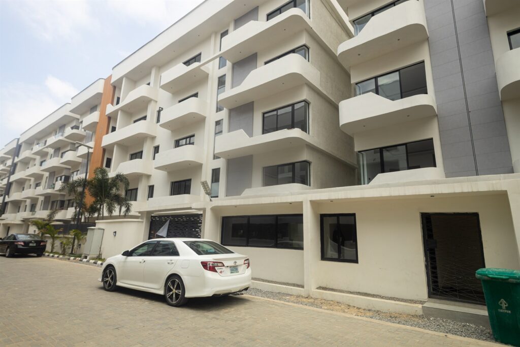 Brum Height 7: Apartment frontage with balconies and roadside parking